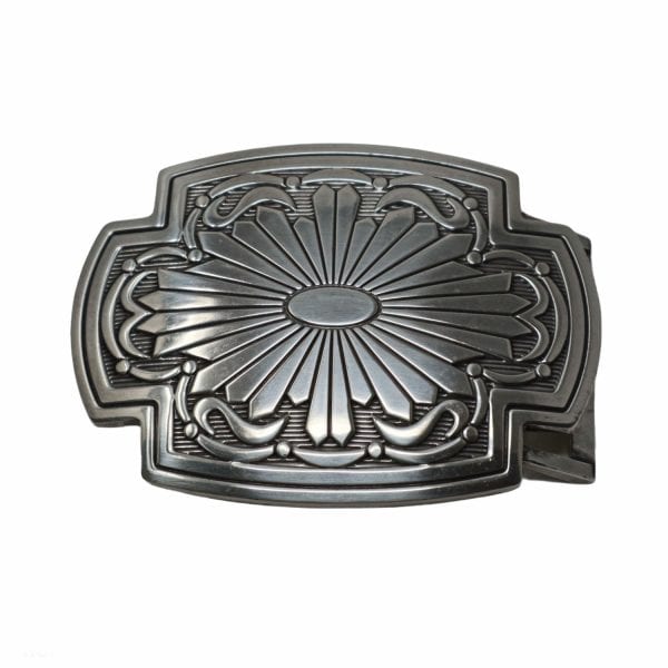 An ornate belt buckle for jeans